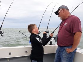 Capt. Dale discussing fishing with one of our youn