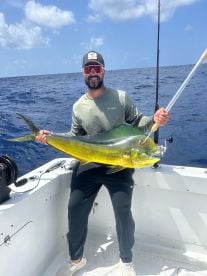 Angler holding a golden mahi-mahi during