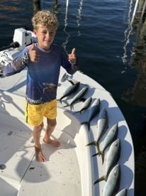 	“Young Angler, Big Catch!”