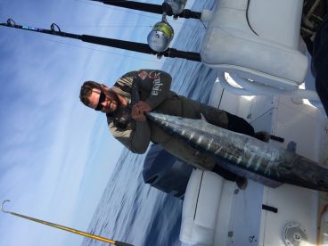 Shawn holding up a Big 70+lb Wahoo great memories!
