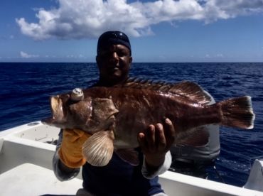 Lindo, our deck hand holds a nice grouper