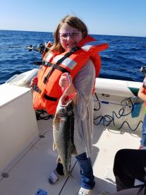 Middle School girl holding Lake Trout