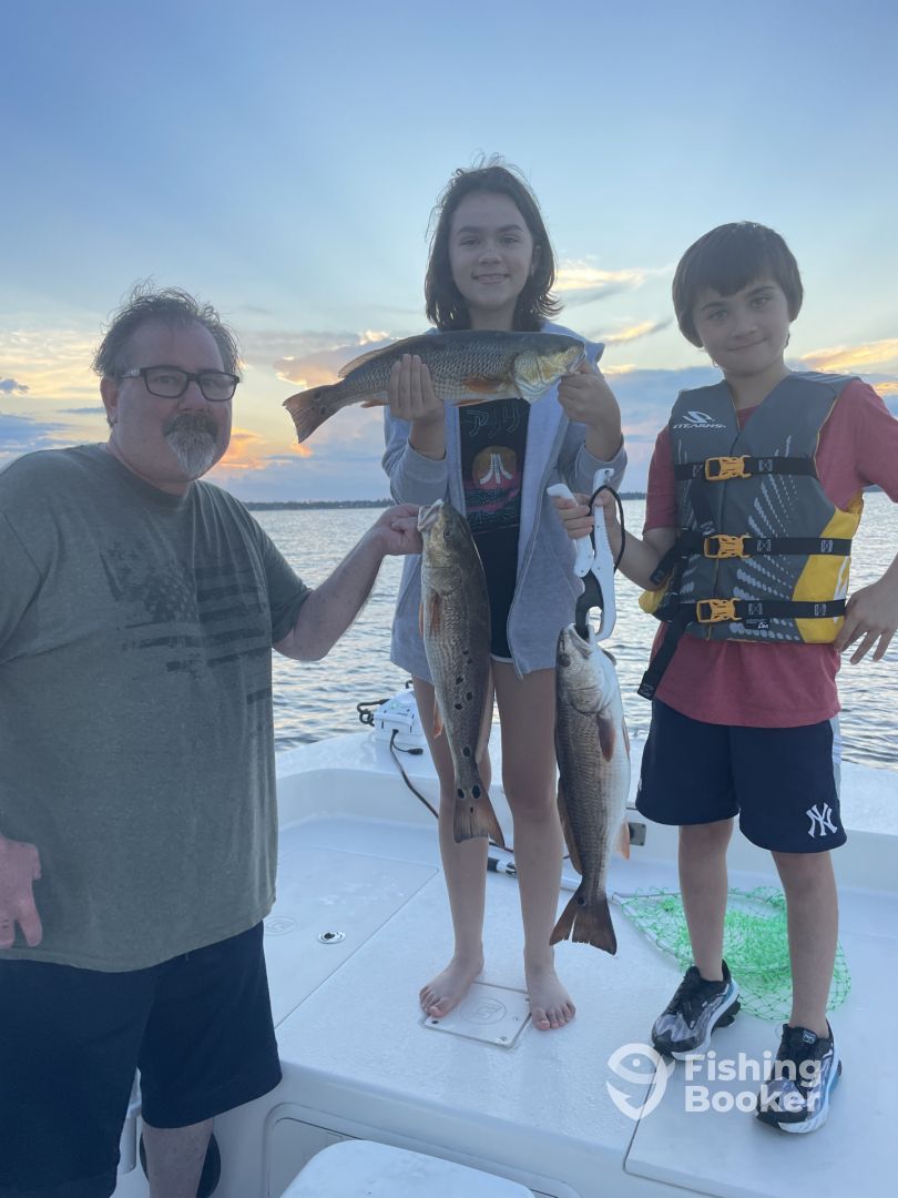 Brian and his kids catching redfish.