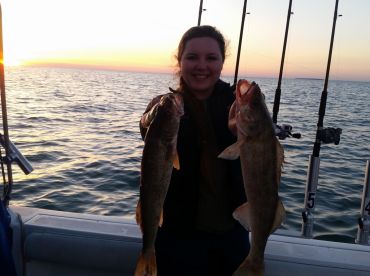 Jillian with 2 of her 4 walleye for the day smiles say it all her group will be back to fish again!
