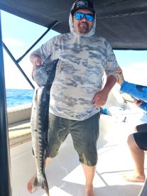 Reeling in a beautiful barracuda