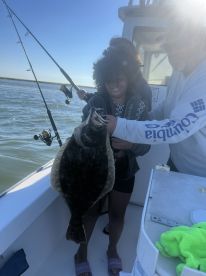 9 year old Riley with a 20 inch flounder