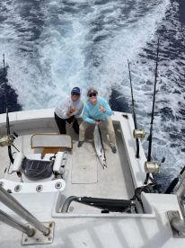 Deckhand Momi & angler with Ono catch