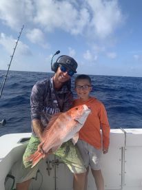 Hunter and Andrew can put fish in the boat!